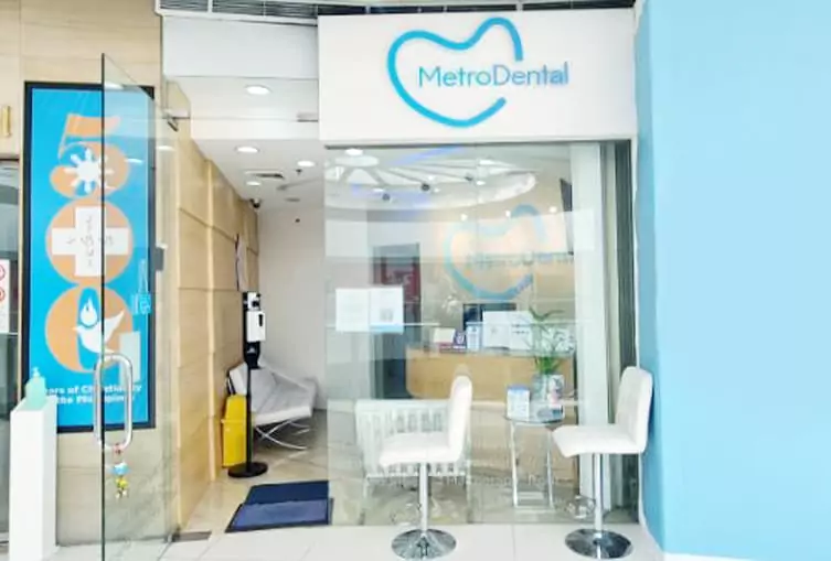 Entrance to Metro Dental clinic: A professional dental office with chairs and a sign displaying the clinic's name.