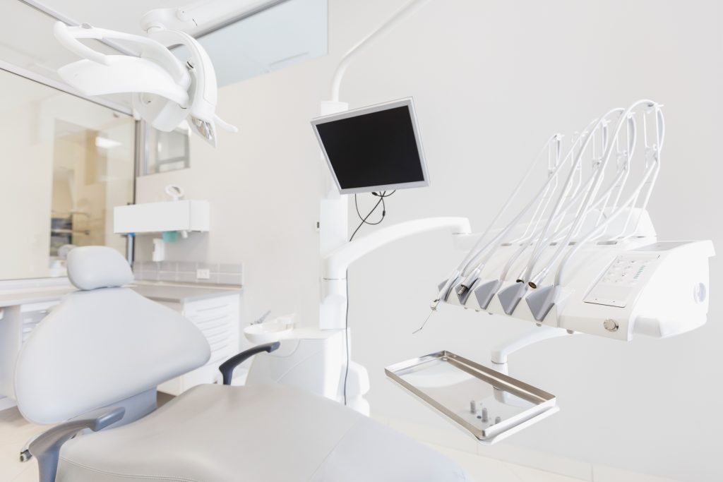 Professional dental clinic showcasing dental equipment and treatment chair