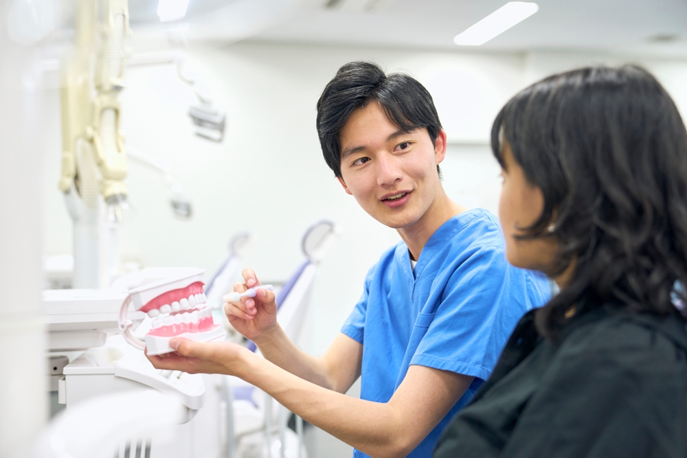 a dentist talking to his patient