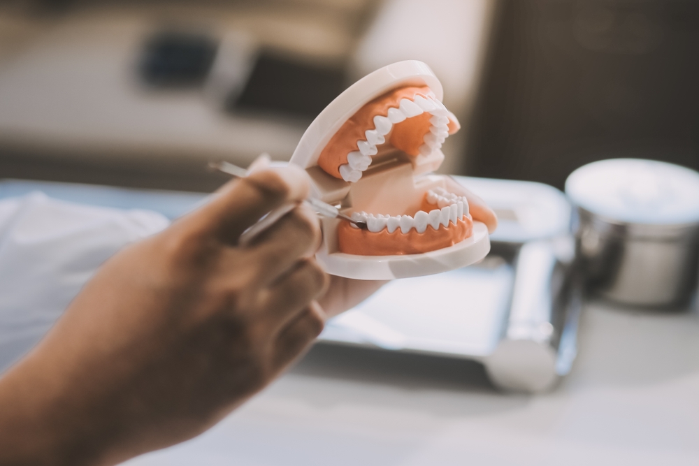 dentist uses specialized dental equipment