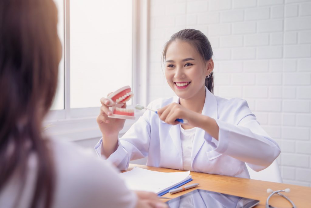 a dentist attending a patient