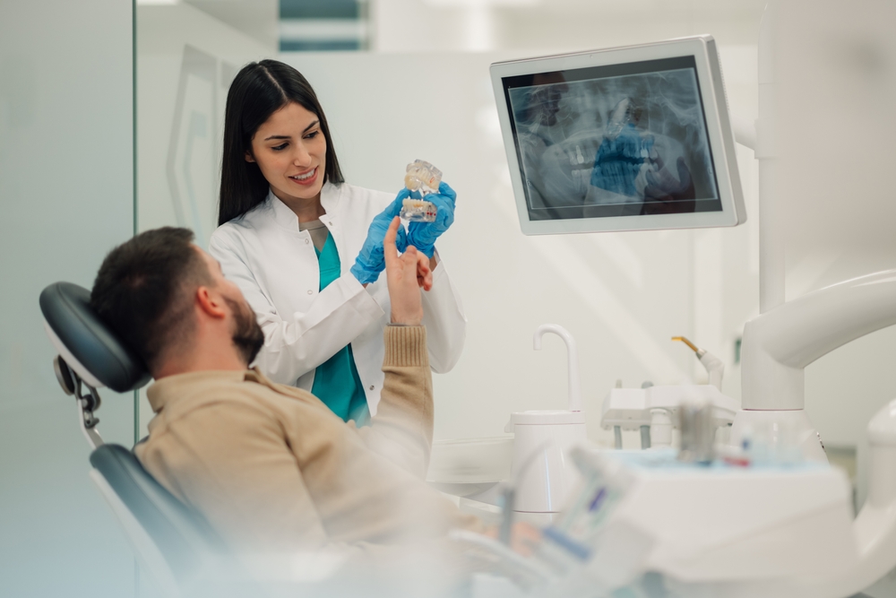 a dentist reading a patient's xray